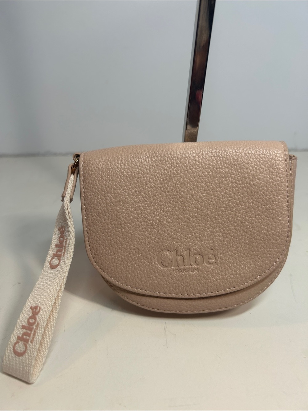 Chloé Pebbled Leather Wristlet in Blush Beige